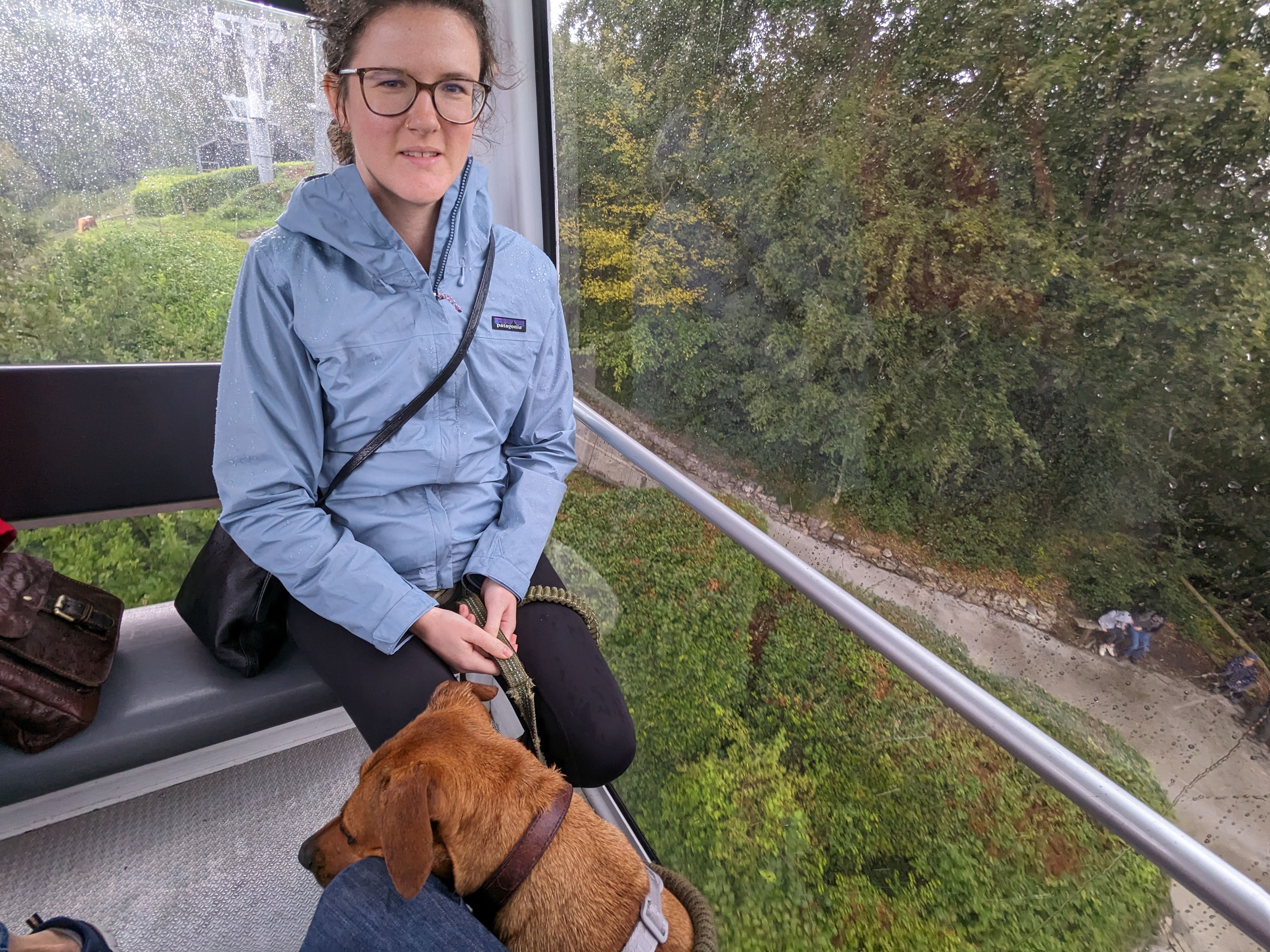 Finn and Sierra in a very cozy plexiglass cable car, overlooking a hillside in Matlock Bath