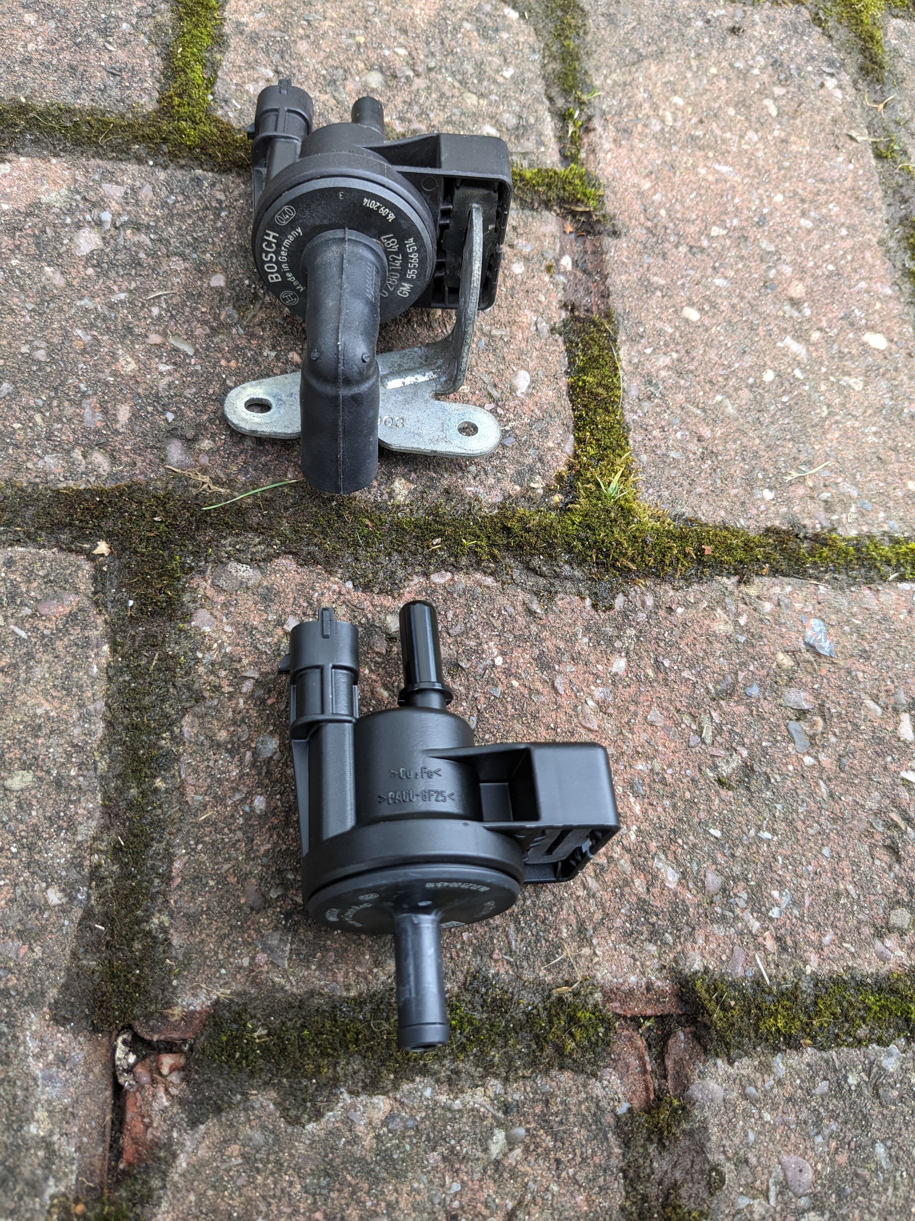 Old purge valve and new purge valve next to each other