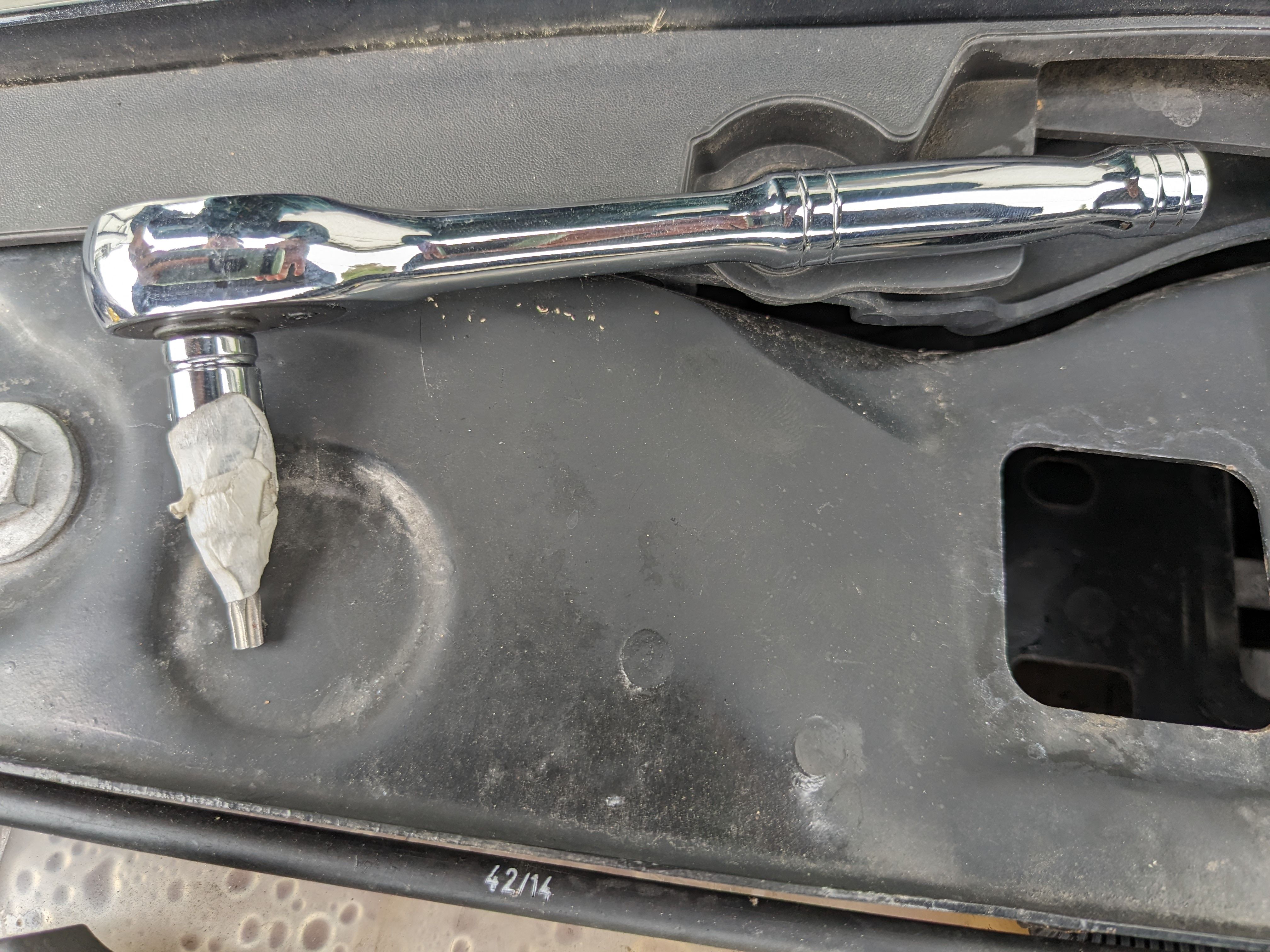 Wratchet wrench with screwdriver head taped on to 1/4 inch driver